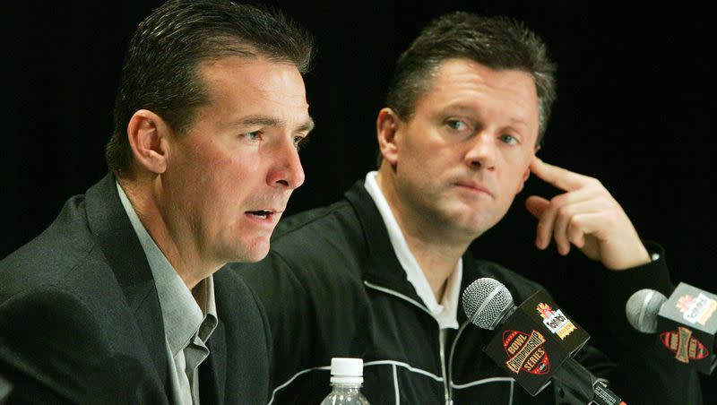 Utah football coaches Urban Meyer, left, and Kyle Whittingham talk with the media Dec. 31, 2004, in Scottsdale, Arizona, leading up to the Fiesta Bowl.