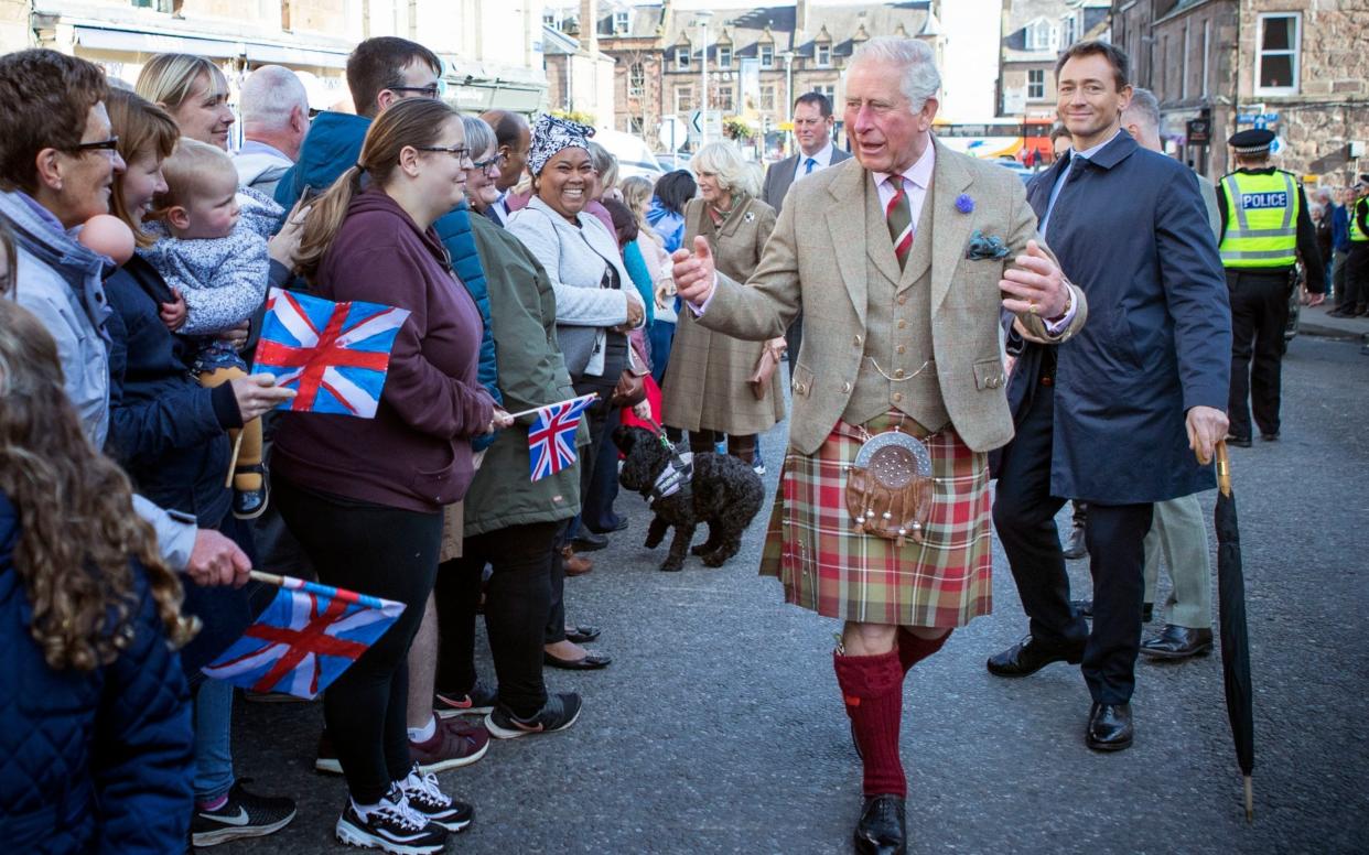 The Prince of Wales, known as the Duke of Rothesay while in Scotland, greets the crowds during a recent visit to Stonehaven. - PA