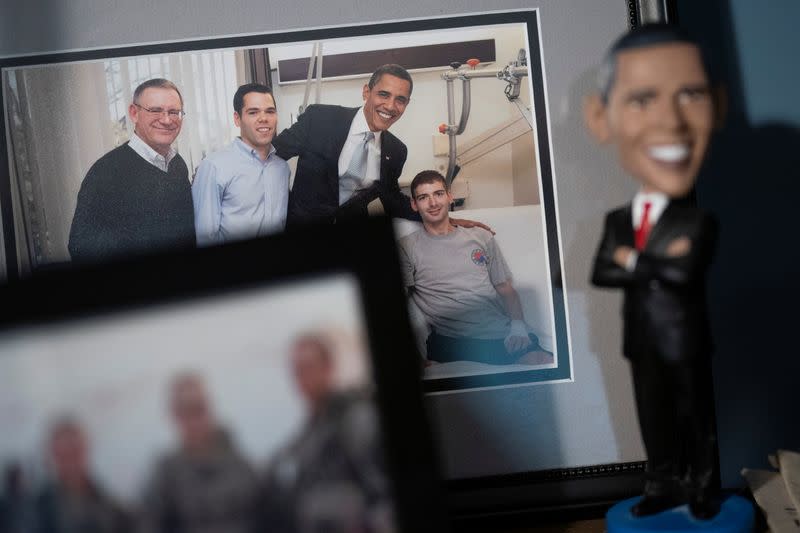 A picture of Retired Army Captain Dan Berschinski and President Barack Obama is seen on a shelf at Berschinski's home in Atlanta