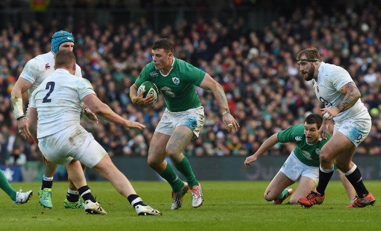 Ireland's centre Robbie Henshaw makes a break during the Six Nations international rugby union match between Ireland and England at Aviva Stadium in Dublin on March 1, 2015