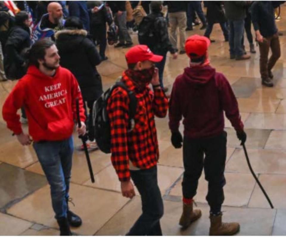 Two witnesses submitted tips to the FBI that identified Grayson Sherrill, left, in this photo taken inside the U.S. Capitol on January 6, 2021, in Washington, D.C.