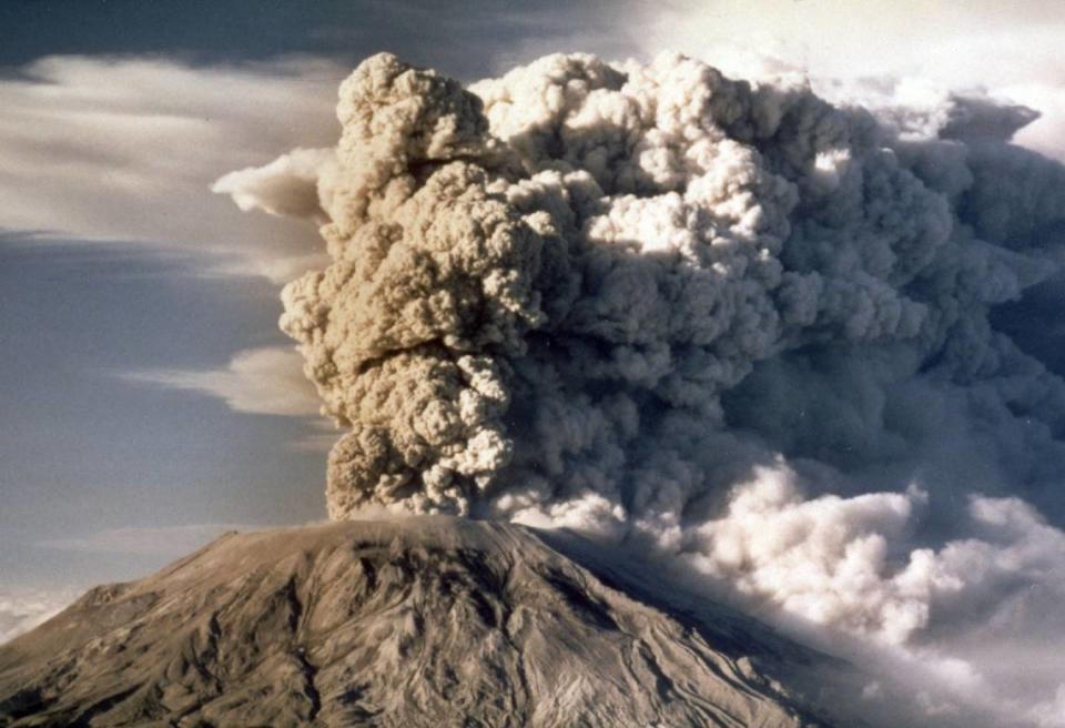 FILE - In this April 1980 file photo, Mount St. Helens spews smoke, soot and ash into the sky in Washington state following a major eruption on May 18, 1980. May 18, 2015 is the 35th anniversary of the eruption that killed more than 50 people and blasted more than 1,300 feet off the mountain’s peak. (AP Photo/Jack Smith, file)