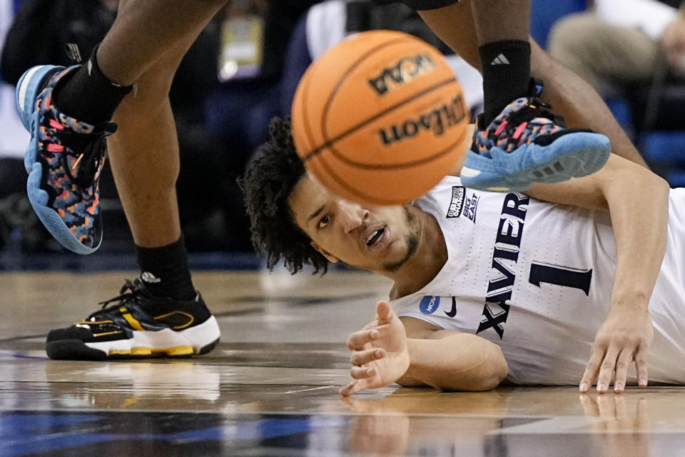 Xavier guard Desmond Claude eyes a loose ball during the second half of a first-round college basketball game Kennesaw State in the NCAA Tournament on Friday, March 17, 2023, in Greensboro, N.C. (AP Photo/Chris Carlson)