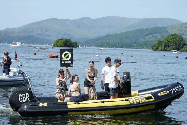 Save Windermere campaigners on a boat on a sunny day