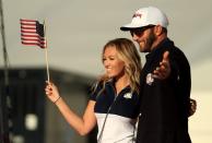 <p>Dustin Johnson of the United States celebrates with Paulina Gretzky after winning the Ryder Cup during singles matches of the 2016 Ryder Cup at Hazeltine National Golf Club on October 2, 2016 in Chaska, Minnesota. (Photo by Mike Ehrmann/PGA of America via Getty Images)</p>
