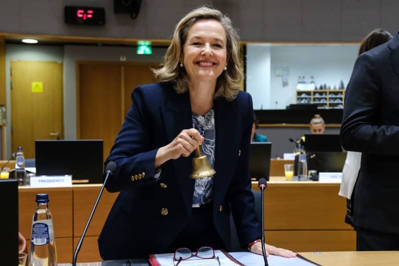 Spanish Economy Minister Nadia Calvino rings a bell during the economic and financial affairs council. Alexandros Michailidis/EU Council/dpa