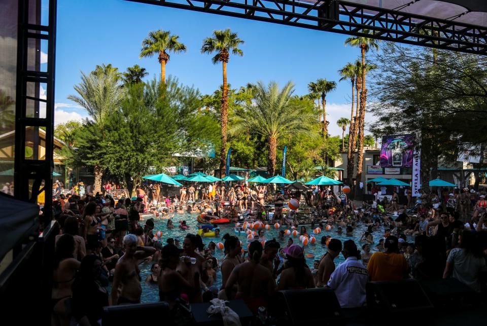 Festivalgoers party at the Margaritaville pool during the L Word Pool Party at The Dinah in Palm Springs, Calif., Saturday, Sept. 24, 2022. 