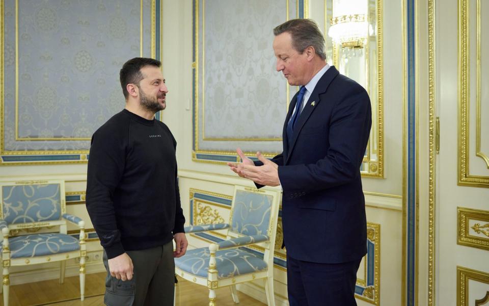 Ukrainian President Volodymyr Zelenskyy, left, speaking with British Foreign Secretary David Cameron on the occasion of the meeting, in Kyiv, Ukraine