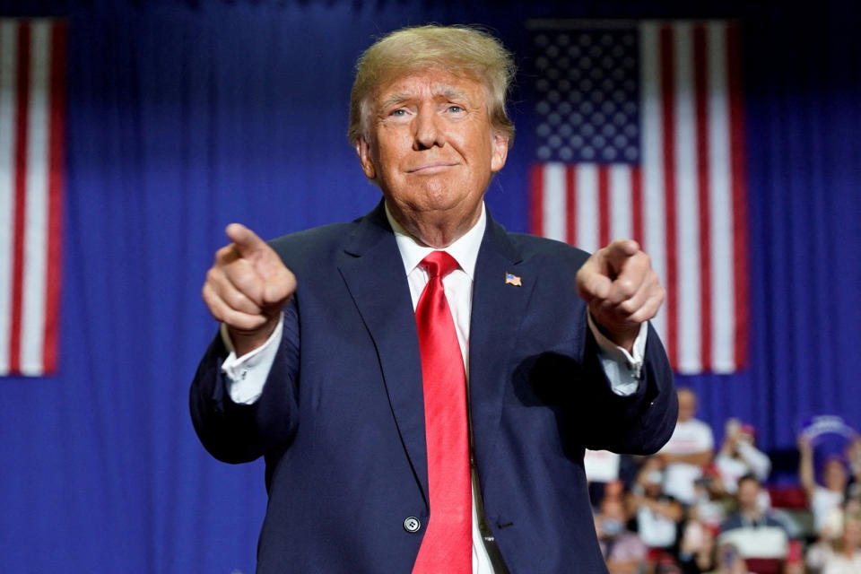 Former US president Donald Trump gestures during a rally.