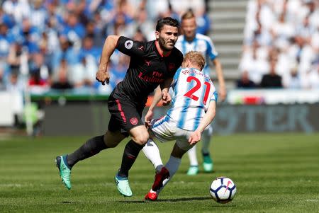 FILE PHOTO: Soccer Football - Premier League - Huddersfield Town vs Arsenal - John Smith's Stadium, Huddersfield, Britain - May 13, 2018 Arsenal's Sead Kolasinac in action with Huddersfield Town's Alex Pritchard Action Images via Reuters/Andrew Boyers