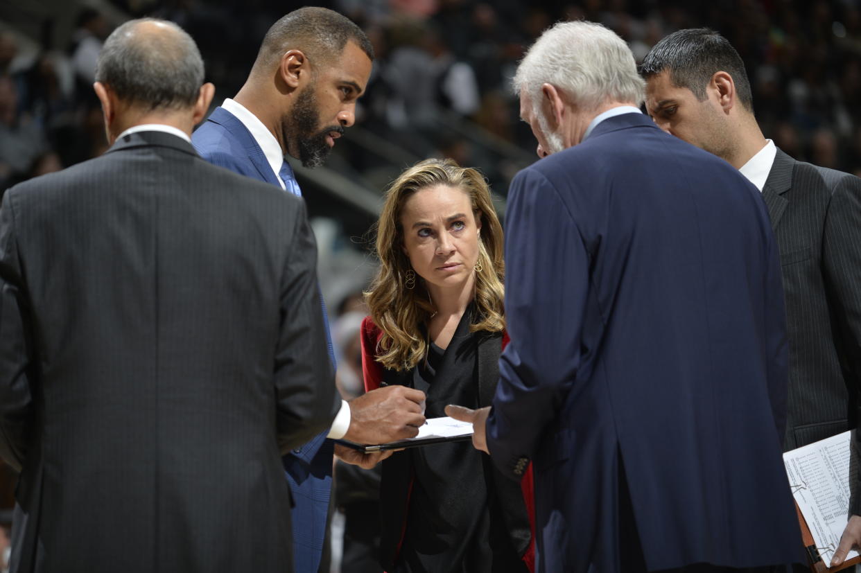 Becky Hammon (center) has been a member of Gregg Popovich’s staff with the San Antonio Spurs since the summer of 2014. (Getty)