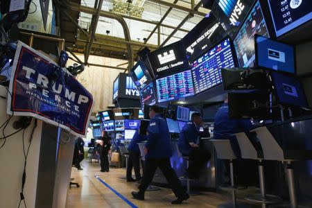 An electoral poster of Donald Trump is displayed on the floor of the New York Stock Exchange (NYSE) the morning after the U.S. presidential election in New York City, U.S., November 9, 2016. REUTERS/Brendan McDermid