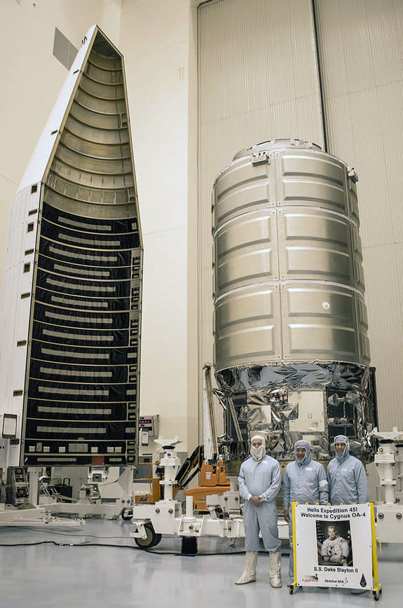 Astronaut Dan Tani (center) joins his fellow Orbital ATK officials to reveal the S.S. Deke Slayton II.