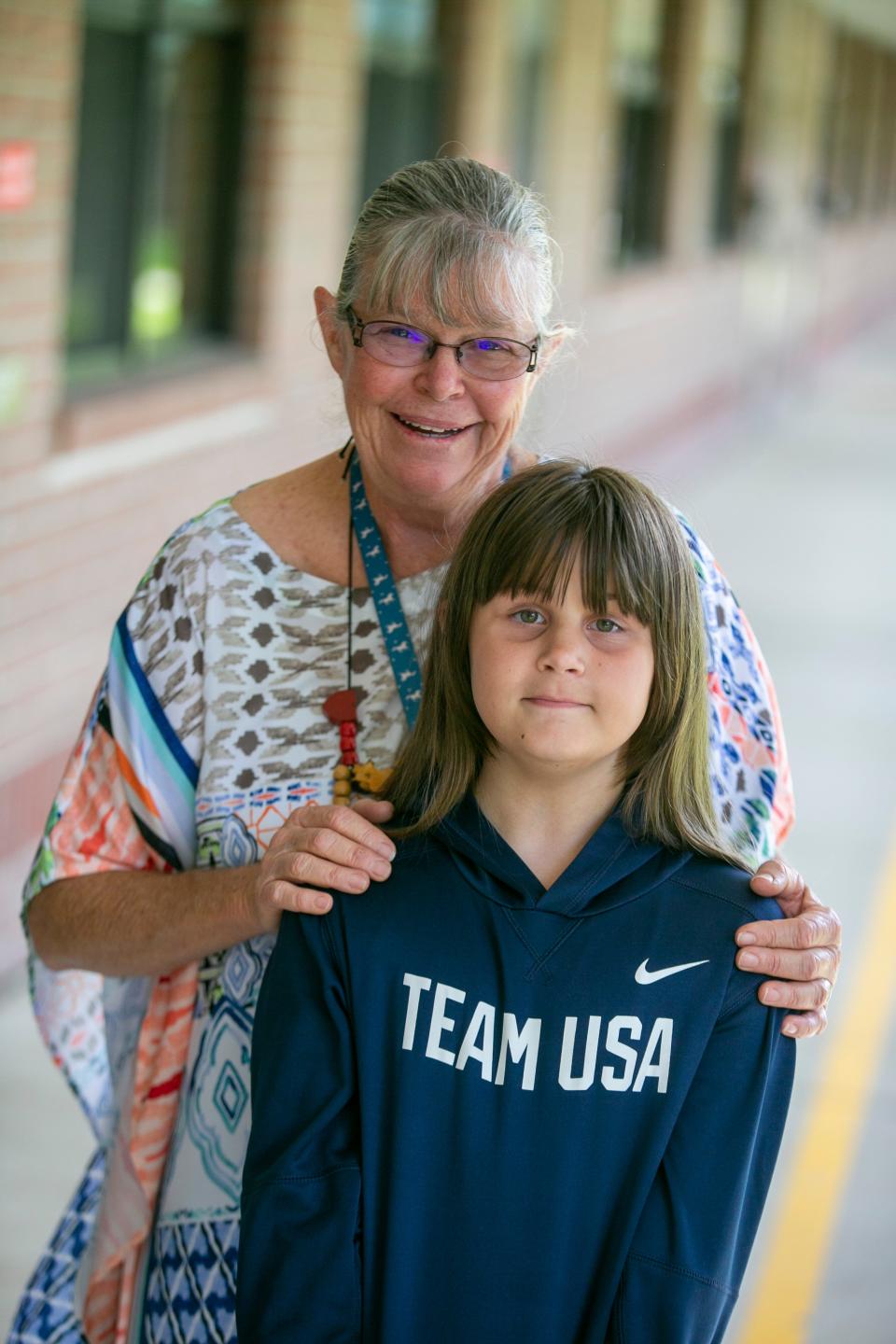 Eight-year-old Kylee Gilchrist spends a moment with College Park Elementary School second grade teacher Lisa Schermerhorn after she received her Amazing Teacher award check from Gannett and the Florida Credit Union on Sept. 9. Kylee nominated Schermerhorn for the national award.