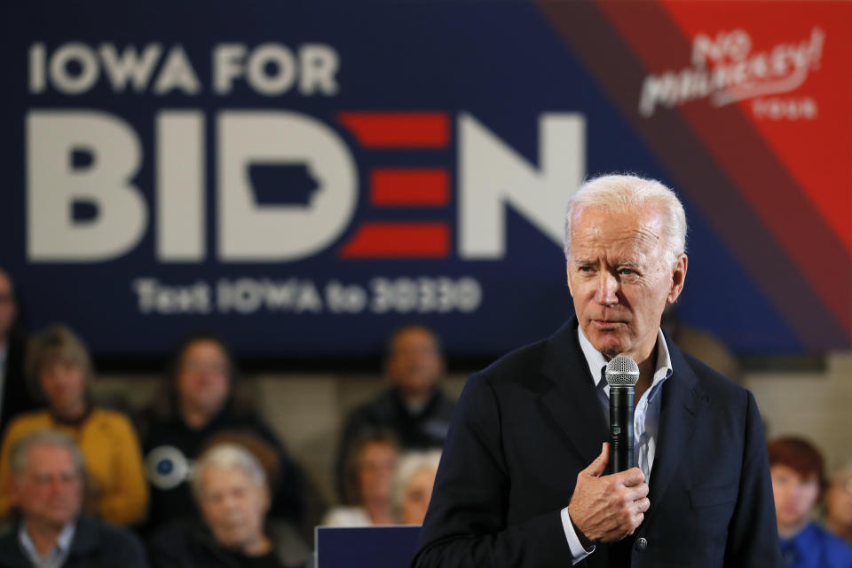 Democratic presidential candidate former Vice President Joe Biden speaks to local residents during a bus tour stop, Tuesday, Dec. 3, 2019, in Mason City, Iowa. (AP Photo/Charlie Neibergall)