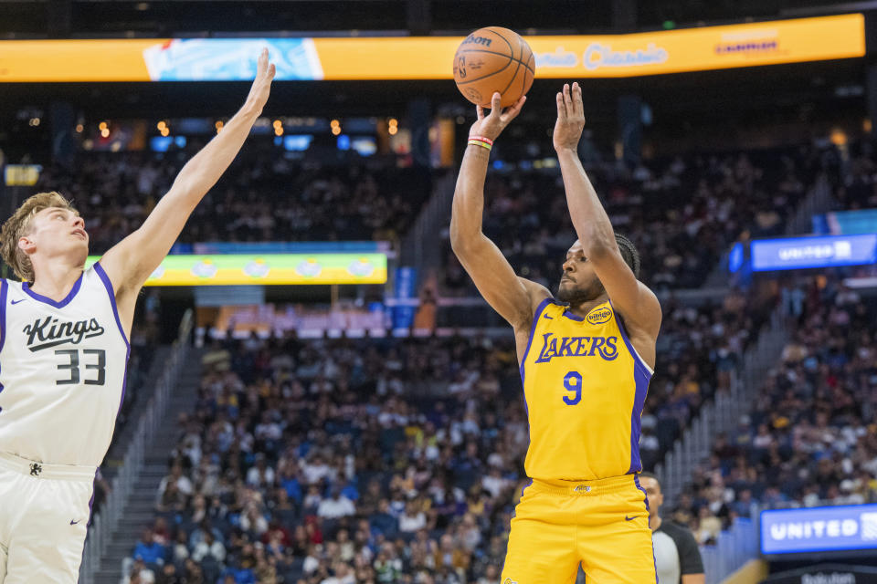 Sacramento Kings guard Dane Goodwin (33) attempts to block a shot by Los Angeles Lakers guard Bronny James (9) during the second half of an NBA summer league basketball game in San Francisco, Saturday, July 6, 2024. (AP Photo/Nic Coury)