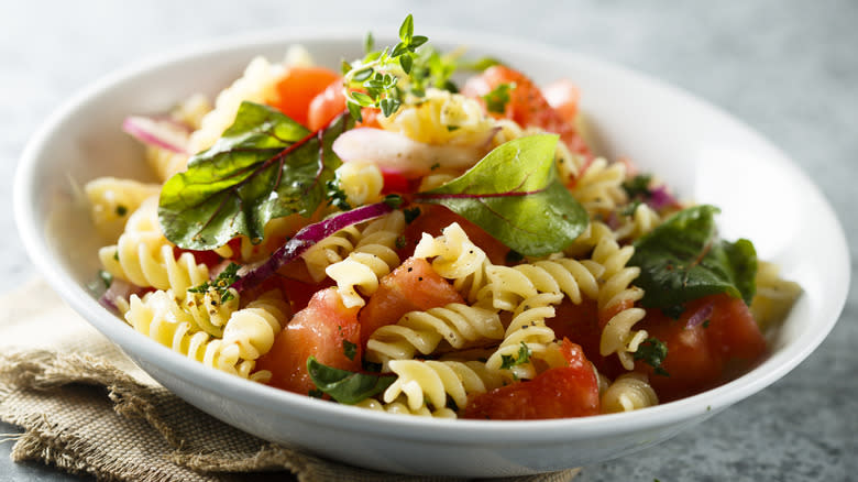 bowl of pasta salad with vegetables