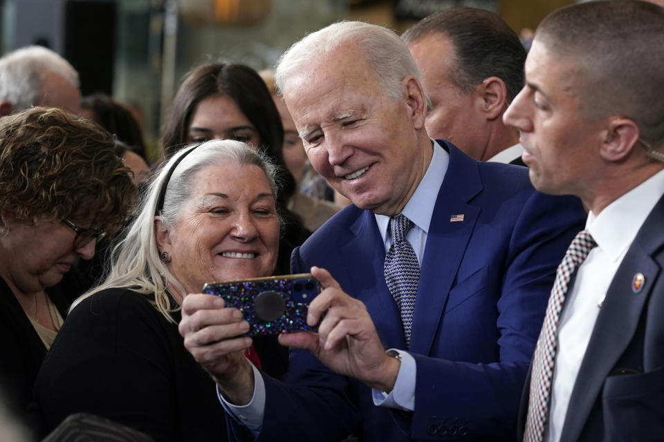 President Joe Biden takes photos with people after speaking about health care and prescription drug costs at the University of Nevada, Las Vegas, Wednesday, March 15, 2023, in Las Vegas. (AP Photo/Evan Vucci)