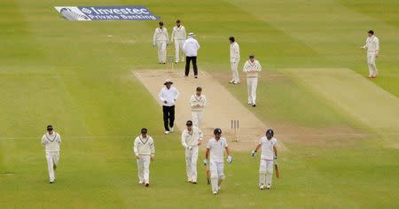 Cricket - England v New Zealand - Investec Test Series Second Test - Headingley - 1/6/15 The players leave the field as the rain stops play Action Images via Reuters / Philip Brown Livepic