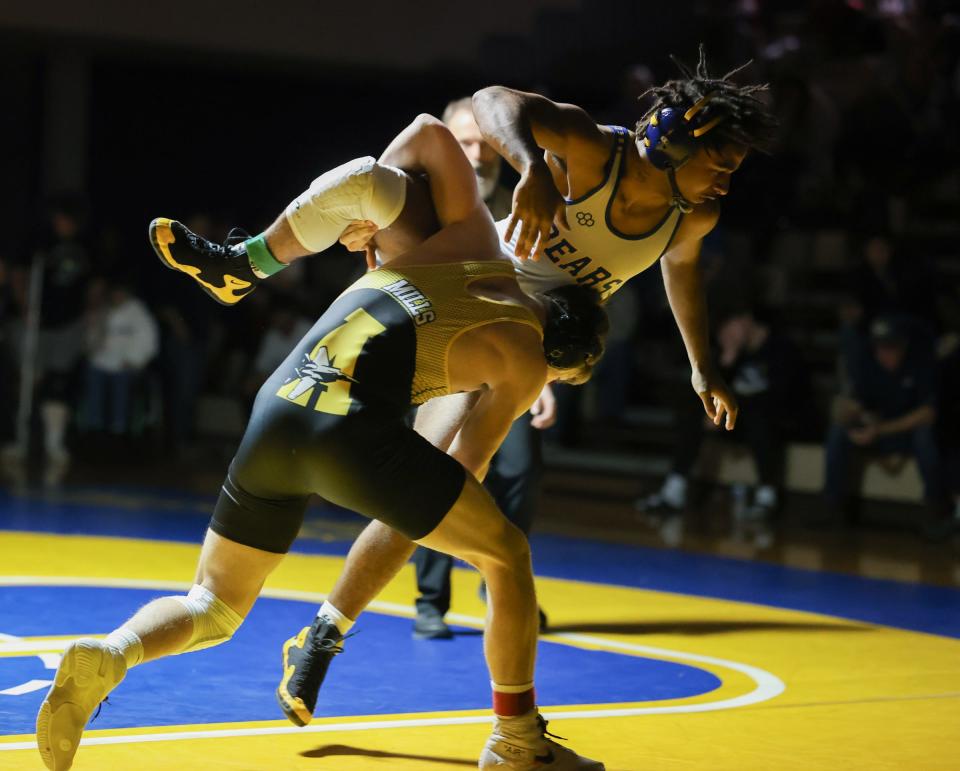 Jack Mills of Airport takes down Jefferson's Malachi Pribyl in the 175-pound finals at the 51st annual Monroe County Sheriff's Invitational Saturday. Mills won 8-0.