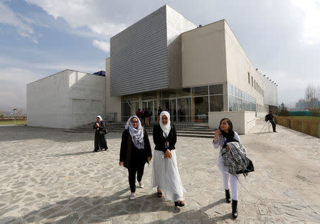 Female students of American University of Afghanistan walk as they arrive for new orientation sessions at a American University in Kabul. REUTERS/Mohammad Ismail