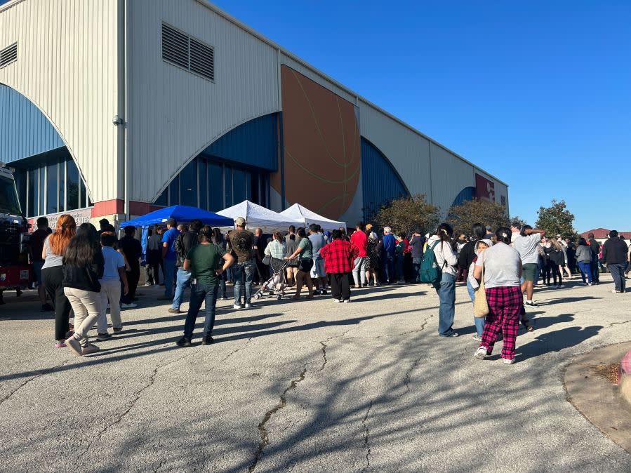 Parents of Northeast Early College High School students line up to pick up their children at Delco Activity Center after an Austin ISD officer was shot and injured on campus on Dec. 5, 2023. (KXAN Photo/Frank Martinez)