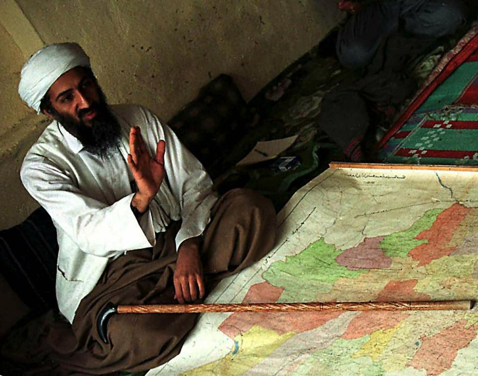 FILE - This April 1998 file photo, shows al-Qaida leader Osama bin Laden in Afghanistan. Although the Taliban had promised Washington during months of negotiations that the U.S. will never again be attacked from Afghan soil, there's no evidence of a break in relations between long-time allies the Taliban and al-Qaida. After the collapse of the Taliban deal in September 2019, it's not clear if they gave Washington any information on where al-Qaida leaders, including Osama bin Laden’s successor, al-Zawahri, are hiding. (AP Photo, File)