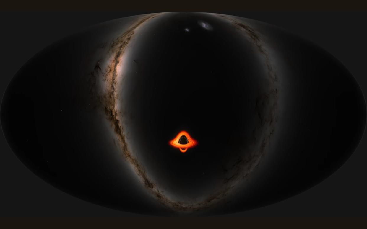 a black hole surrounded by a red disc of light