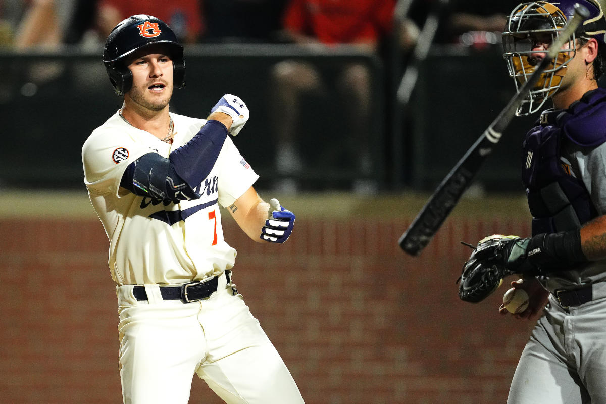 Auburn infielder Cole Foster (7) runs to first after hitting a