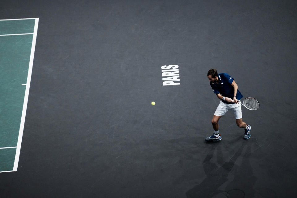 Russia's Daniil Medvedev returns the ball to Serbia's Novak Djokovic during the final match of the Paris Masters tennis tournament at the Accor Arena in Paris, Sunday, Nov.7, 2021. (AP Photo/Thibault Camus)