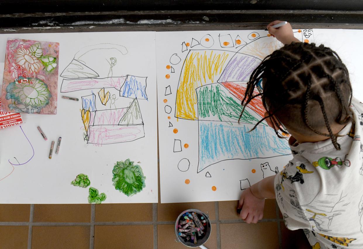 Samuel Laubacher, 8, of Canton, works on a project during "Go Big! WPA Mural Artist Celebration" part of School's Out Free Mondays event at the Canton Museum of Art.