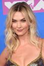 <p>Karlie Kloss' beachy waves at the VMA's were styled by the hairstylist Jennifer Yepez, who <a rel="nofollow noopener" href="https://www.instagram.com/p/BmuISUWhUTo/?hl=en&taken-by=jennifer_yepez" target="_blank" data-ylk="slk:revealed on Instagram;elm:context_link;itc:0;sec:content-canvas" class="link ">revealed on Instagram</a> the exact hair products she used to create the model's loose, textured curls. To achieve the look, Yepez combined Kerastase's <a rel="nofollow noopener" href="https://www.feelunique.com/p/Kerastase-Mousse-Bouffante-150ml?gclid=CjwKCAjw8O7bBRB0EiwAfbrThwG5gvUnbuXxKLzwzGgvjRet6MdwXGhziXgB--aKeu4017hOcUAn_xoCKnYQAvD_BwE&gclsrc=aw.ds" target="_blank" data-ylk="slk:Mousse Bouffant;elm:context_link;itc:0;sec:content-canvas" class="link ">Mousse Bouffant</a>, £14.95, most likely to give height at the crown, with <a rel="nofollow noopener" href="https://www.feelunique.com/p/Kerastase-Resistance-Ciment-Thermique-125ml?gclid=CjwKCAjw8O7bBRB0EiwAfbrTh6c3D_NQO66yiYQURtP8EPG5tVmpr5j7Db7TkjTOWqRkuig3CnLfqhoCs2MQAvD_BwE&gclsrc=aw.ds" target="_blank" data-ylk="slk:Ciment Thermique;elm:context_link;itc:0;sec:content-canvas" class="link ">Ciment Thermique</a>, £16, for help styling and the <a rel="nofollow noopener" href="https://www.feelunique.com/p/Kerastase-K-Styling-V-I-P-Volume-In-Powder-250ml?gclid=CjwKCAjw8O7bBRB0EiwAfbrTh9uEB-49tJtAdWbm41oPpGJyI2h5SpavD53iXJLVylaaLIjSuwl0IhoCDaoQAvD_BwE&gclsrc=aw.ds" target="_blank" data-ylk="slk:V.I.P Spray;elm:context_link;itc:0;sec:content-canvas" class="link ">V.I.P Spray</a>, £14.95, to add volume. </p><p>For more advice on how to create beachy waves, head to our <a rel="nofollow noopener" href="https://www.harpersbazaar.com/uk/beauty/hair/news/a41664/beachy-waves-expert-tips/" target="_blank" data-ylk="slk:gallery;elm:context_link;itc:0;sec:content-canvas" class="link ">gallery</a>.</p>