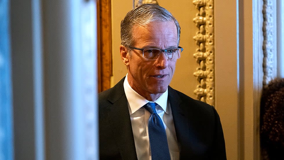 Sen. John Thune (R-S.D.) speaks to reporter outside the Senate Chamber during the nomination vote of Robert Califf to be Commissioner of the Food and Drug Administration on Tuesday, February 15, 2022.