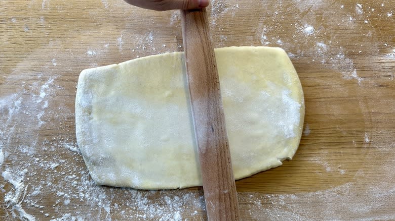rolling dough on floured surface