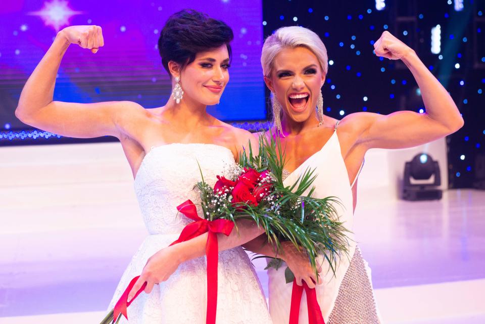 Preliminary winners Miss Georgia Volunteer Victoria Hill and Miss Indiana Volunteer Stevie Griffin flex their muscles during a photoshoot after the opening day of the 2023 Miss Volunteer America Pageant inside Carl Perkins Center, Jackson, Tenn.  on Wednesday, Jun. 21, 2023.