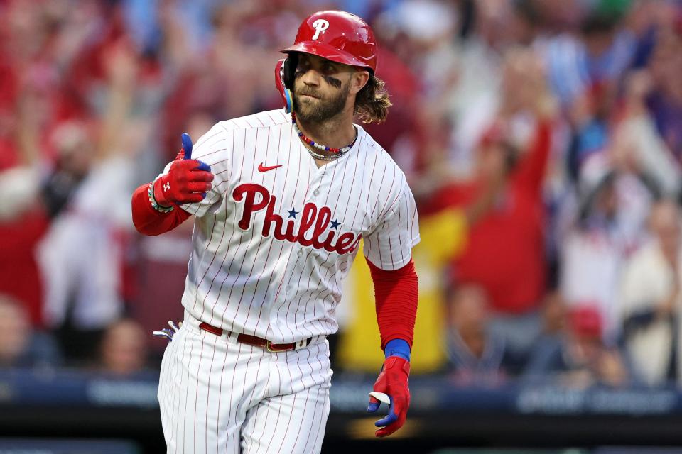 Phillies first baseman Bryce Harper celebrates after hitting a three run home run in the third inning, his first of two in Game 3.
