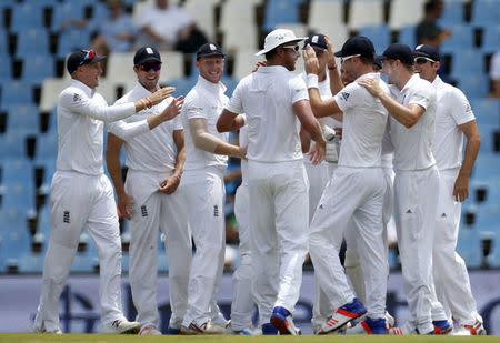 England's cricket players celebrate the dismissal of South Africa's Dean Elgar who was caught out by James Taylor during the fourth cricket test match at Centurion, South Africa, January 22, 2016. REUTERS/Siphiwe Sibeko