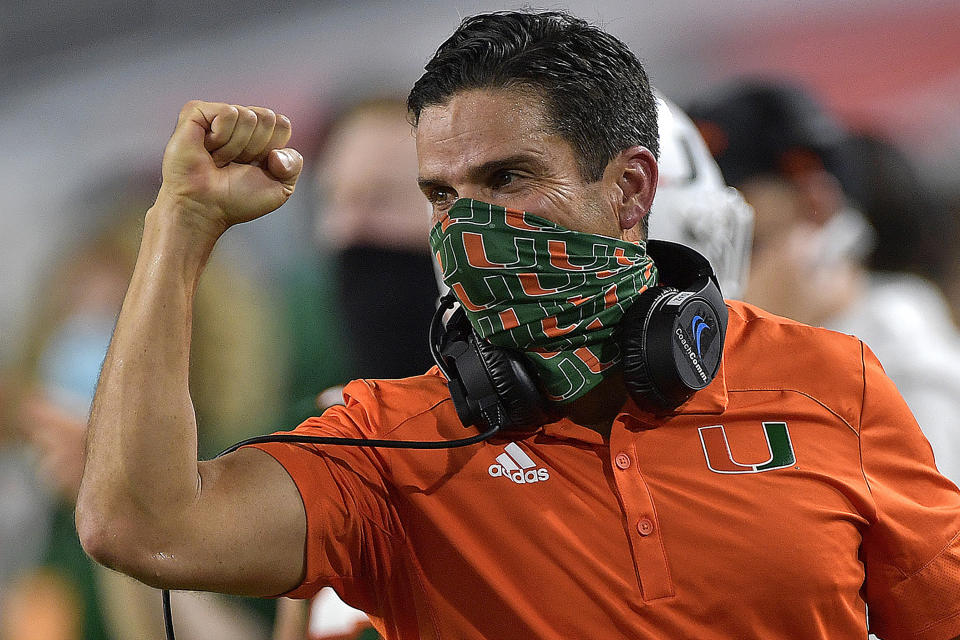 FILE - In this Saturday, Sept. 26, 2020, file photo, Miami head coach Manny Diaz celebrates a touchdown against Florida State during the first half of an NCAA college football game, in Miami Gardens, Fla. The competition isn’t as formidable this week for the Miami Hurricanes, and that has their coach concerned. After losing last week at No. 1 Clemson, Miami will try to rebound Saturday against Pittsburgh. (Michael Laughlin/South Florida Sun-Sentinel via AP, File)