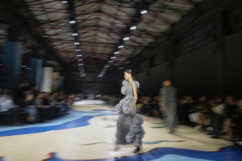 A model wears a creation as part of the Bottega Veneta women's Spring Summer 2024 collection presented in Milan, Italy, Saturday, Sept. 23, 2023. (AP Photo/Antonio Calanni)