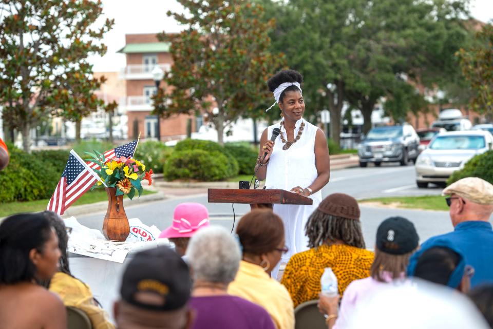 Robin Reshard of the Kukua Institute speaks Saturday, June 26, 2021, during the dedication ceremony for the "Middle Passage to Pensacola" historic port marker at Plaza de Luna in Pensacola.