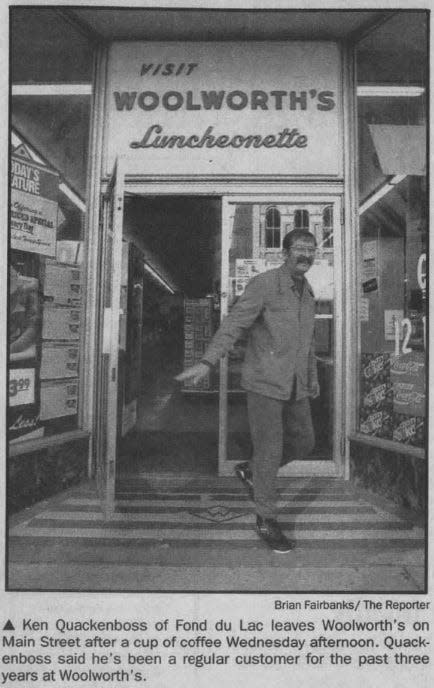 Regular customer Ken Quackenboss exits Woolworth's after a cup of coffee in the store's final days in 1993.