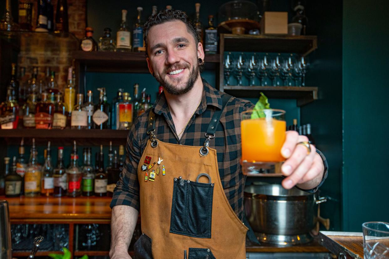 Elliott Ernst serves up a cocktail Thursday, Jan. 12, 2023, at Abreo in Rockford.