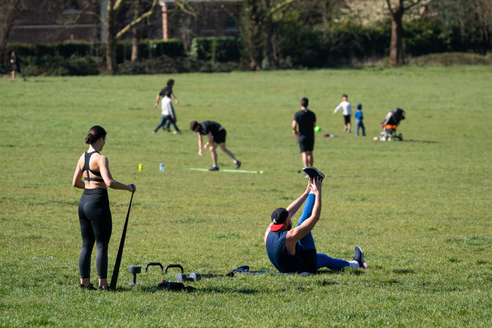 Members of the public exercise on Primrose Hill, London, as the UK continues in lockdown to help curb the spread of the coronavirus.