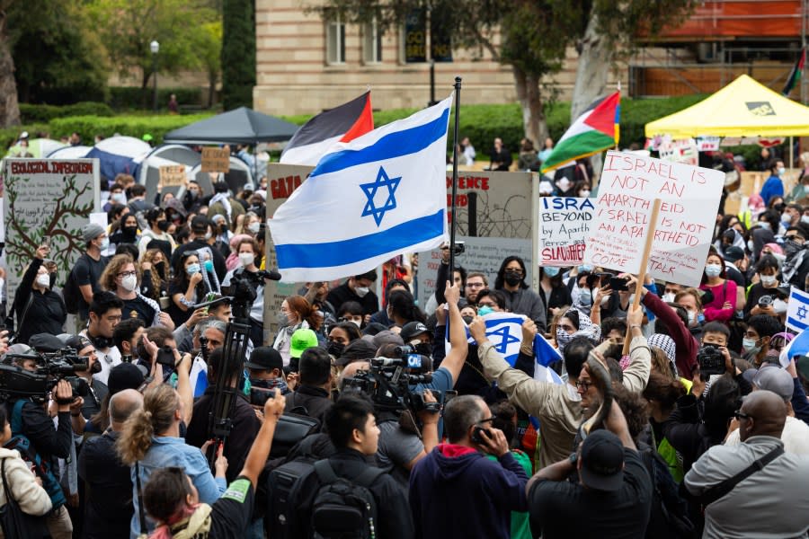 LOS ANGELES, CA – APRIL 25: Pro-Palestinian demonstrators and Pro-Israel demonstrators clash with each other on the campus of the University of California Los Angeles (UCLA) on April 25, 2024 in Los Angeles, California. Students protesting on campuses across US ask colleges to cut investments supporting Israel. (Photo by Qian Weizhong/VCG via Getty Images)