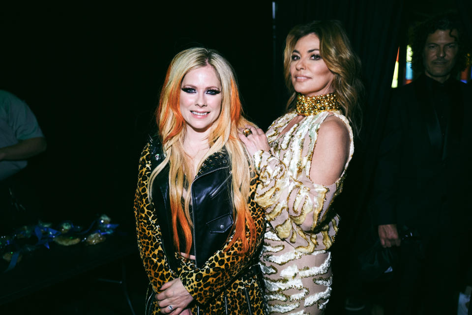 Avril Lavigne (left) posted a lip sync video on TikTok, where she performs to one of Shania Twain's hit songs. (Photo by John Shearer/Getty Images for ACM)