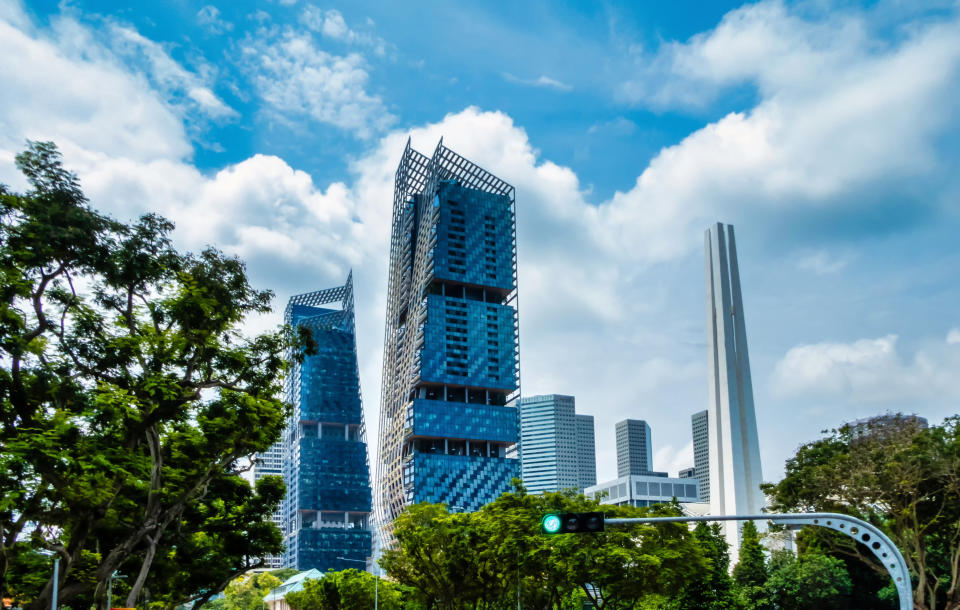 Singapore, Singapore - August  05, 2018:  JW Marriott hotel towers and Civilian War Memorial