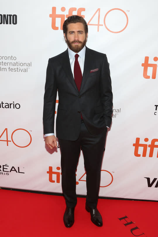 <p>Could Jake G. be any more dapper? Is this dark gray/black suit, with its slight sheen—and that burgundy tie and matching pocket square—Mr. Gyllenhaal looks just about ready to meet me at the end of the aisle for our New Year’s Eve wedding. Don’t worry, Jakey—your boutonnière’s in the limo. <i>(Photo: Getty)</i></p>