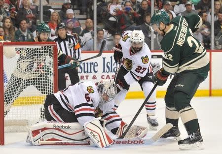 May 5, 2015; Saint Paul, MN, USA; Minnesota Wild forward Nino Niederreiter (22) looks for a rebound after Chicago Blackhawks goalie Corey Crawford (50) makes a save during the second period in game three of the second round of the 2015 Stanley Cup Playoffs at Xcel Energy Center. Mandatory Credit: Marilyn Indahl-USA TODAY Sports