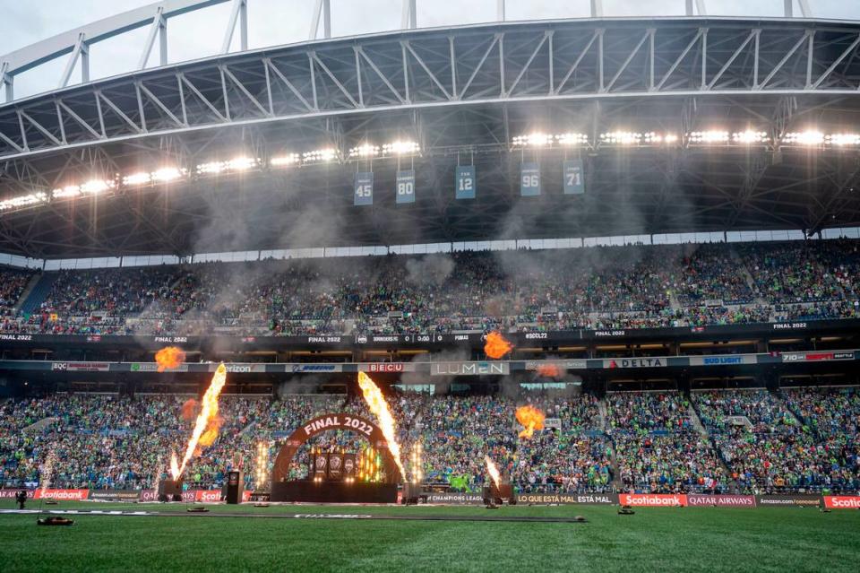 Pyrotechnics explode around a DJ before a CONCACAF Champions League match at Lumen Field in Seattle earlier this month.