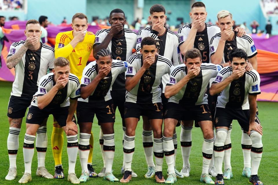 Germany players cover their mouths as a protest against FIFA (PA Wire)